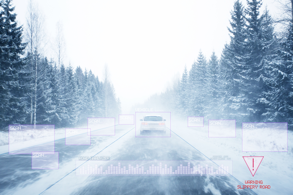 Vehicle driving on a snowy road with ADAS scanning visualization overlay